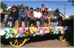 ACE students riding on a student-decorated float at the Tucson Rodeo Parade